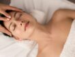Calm woman with closed eyes at massage