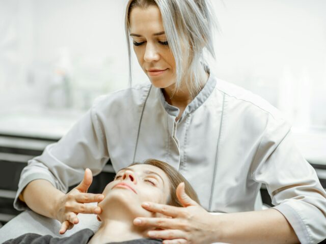 Woman during the facial massage at the beaty salon